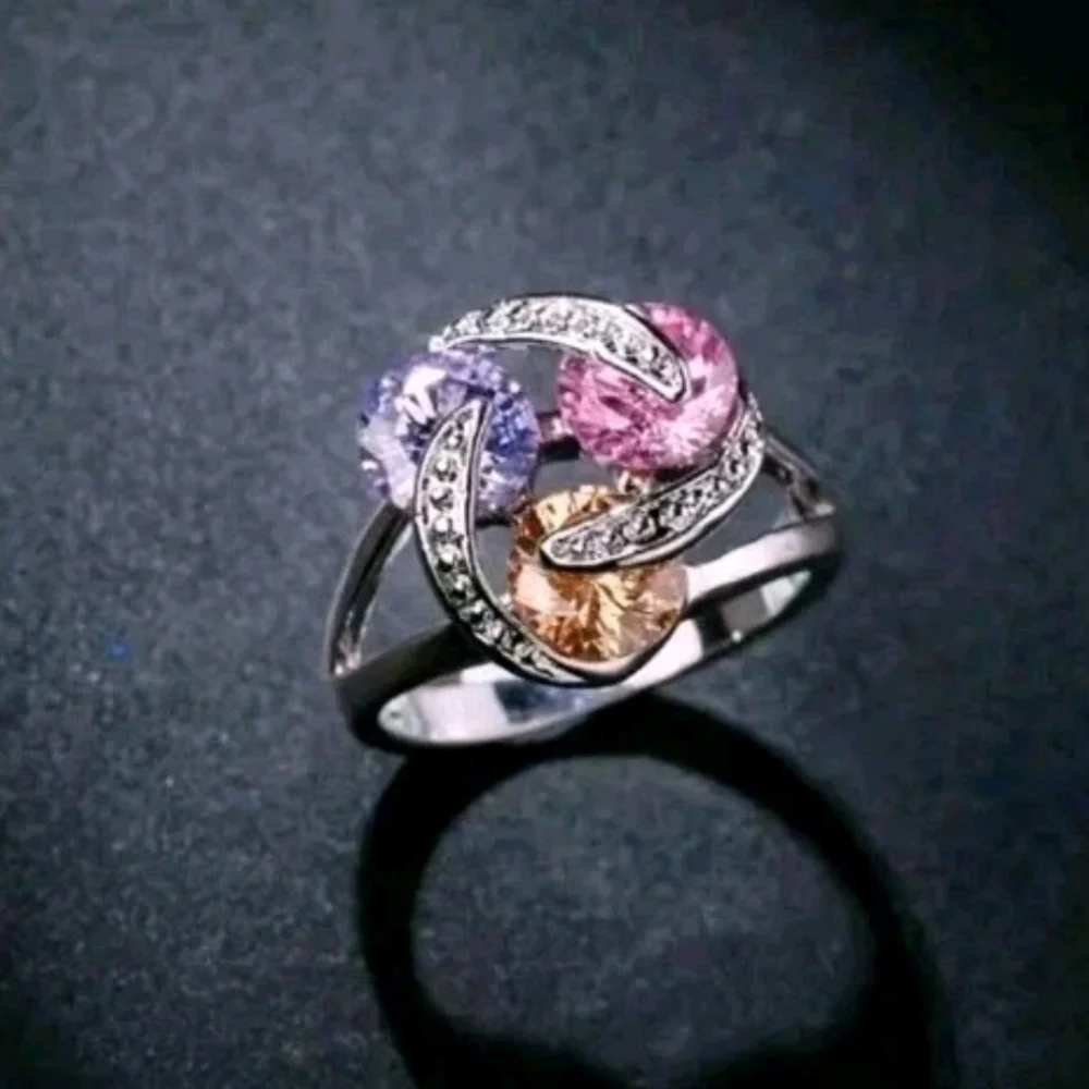 Sparkling Zirconia With Pink,yellow, and Purple Rotating Gemstone Design Sz 8